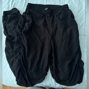 FashionNova swishy track pants